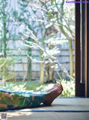 A woman in a kimono is posing for a picture.