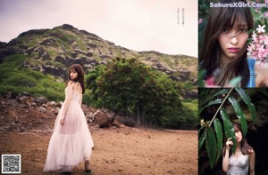 A woman in a white dress standing on a dirt road.