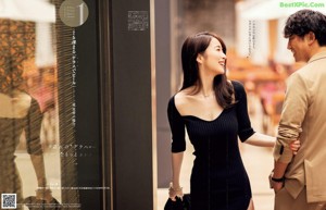 a magazine page with a picture of a woman in a black dress