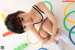 A close up of a young woman with short black hair.